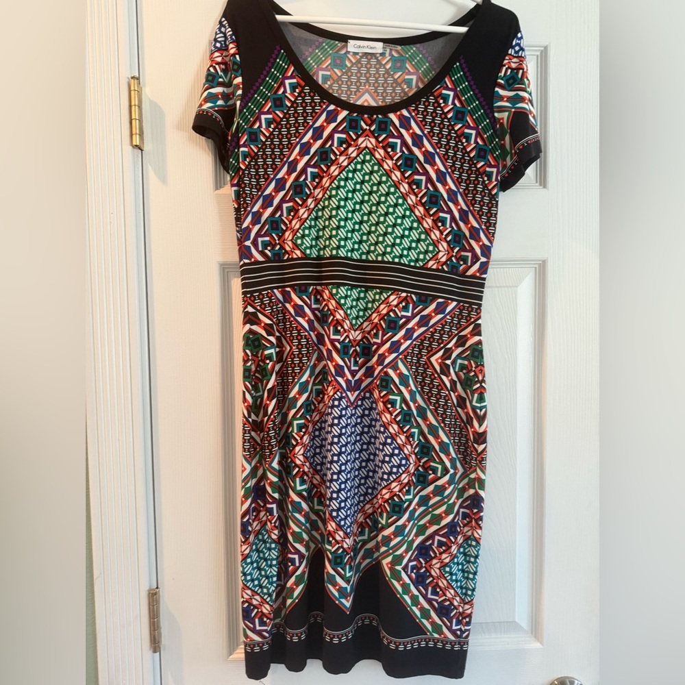 Knee length stretchy dress.  Never worn, but tags removed